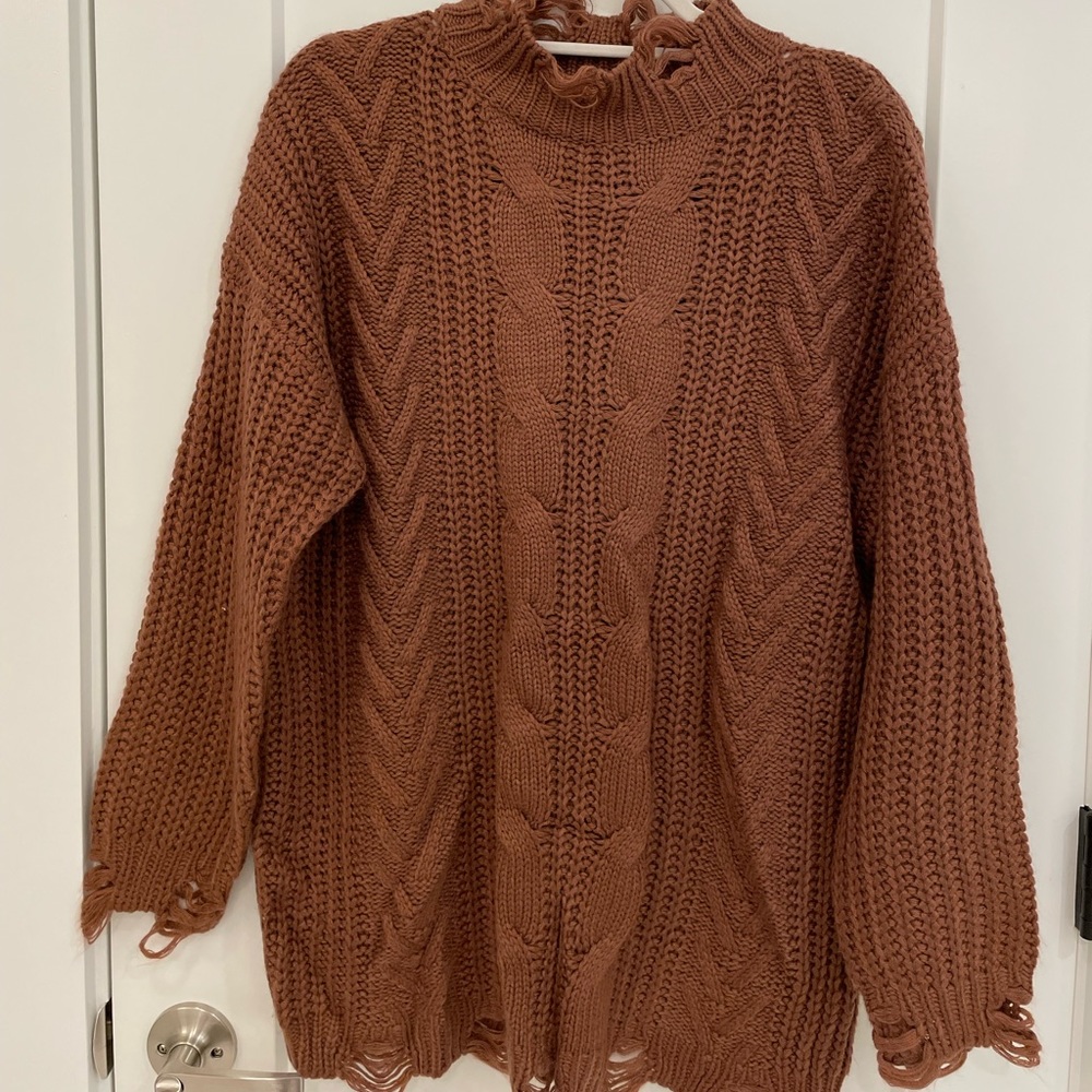 Distressed shift sweater dress.